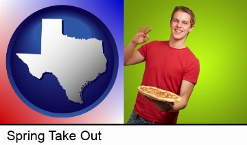 a happy teenager holding a take-out pizza in Spring, TX