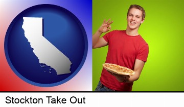 a happy teenager holding a take-out pizza in Stockton, CA