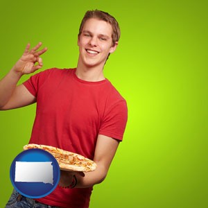 a happy teenager holding a take-out pizza - with South Dakota icon