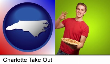 a happy teenager holding a take-out pizza in Charlotte, NC