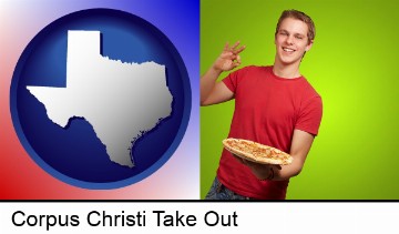 a happy teenager holding a take-out pizza in Corpus Christi, TX